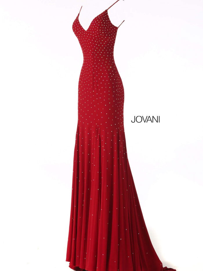 Model showcasing the back of Jovani 63563 red gown with open back