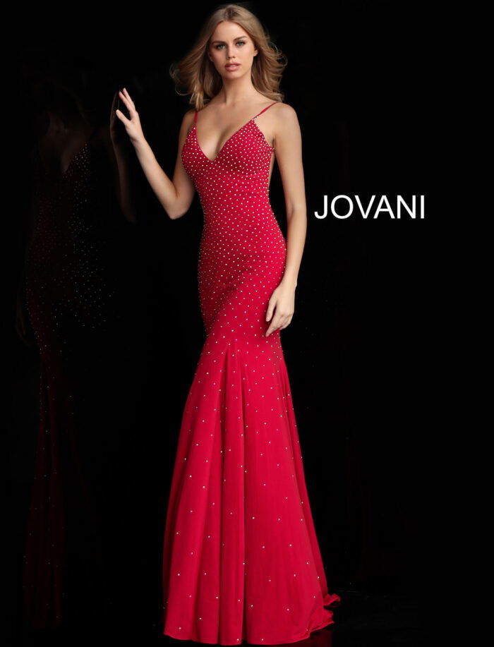 Model wearing Jovani 63563 red gown with plunging neckline and embellishments
