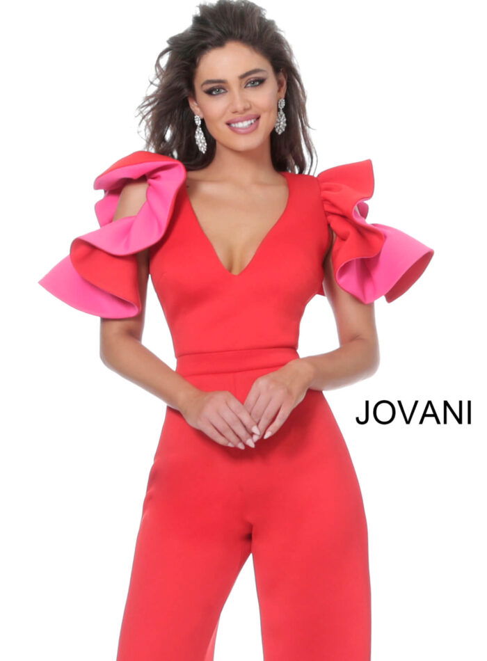 Model wearing Jovani 68736 red jumpsuit with pink ruffled sleeves, close-up front view.