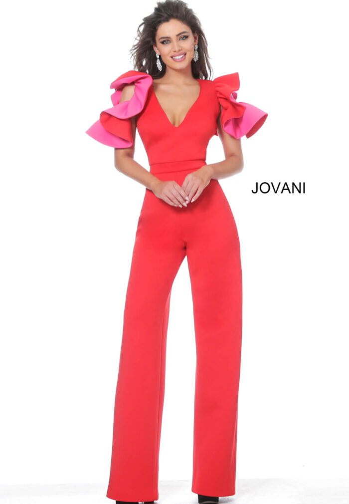 Model wearing Jovani 68736 red jumpsuit with pink ruffled sleeves, front view, wide-leg silhouette.