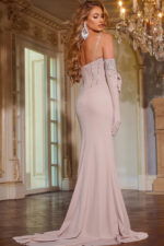 Model wearing Jovani D5016 back view beige embellished gown with subtle train.