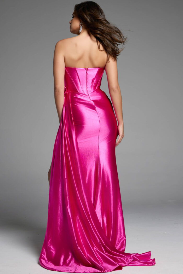 Strapless satin gown with a bow-shaped bodice and a daring front slit.