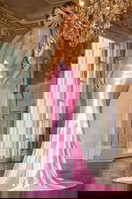 Back view of model wearing D5054 dress in pink with a sophisticated open back design.