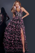 Model wearing D5065 black floral applique gown with high slit and sweetheart neckline from Jovani, front view.