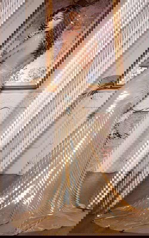 Back view of Jovani D5067 gold dress showing elegant design and slight train