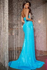 Back view of model in Jovani D5074 blue gown, showcasing open back and sleek silhouette.