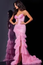 model wearing D5114 pink dress showcasing elegant ruffles and silhouette