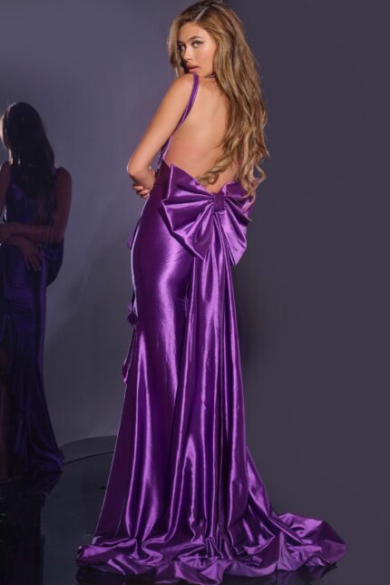 Back view of Jovani D5305 purple gown with open back and large bow.
