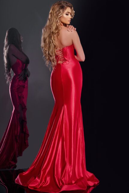 Back view of model wearing Jovani D5306 red gown with lace-up detail