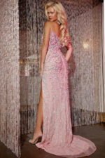 Model wearing Jovani D5711 pink gown, back view with embellishments.