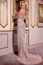 Model wearing Jovani D5711 pink gown with detailed back view.