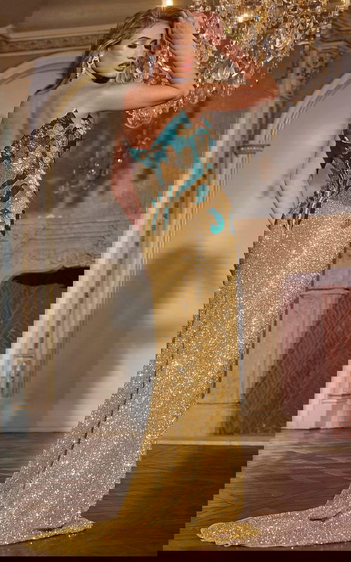 Model wearing Jovani D5723 nude sequin gown with elegant train from the back.