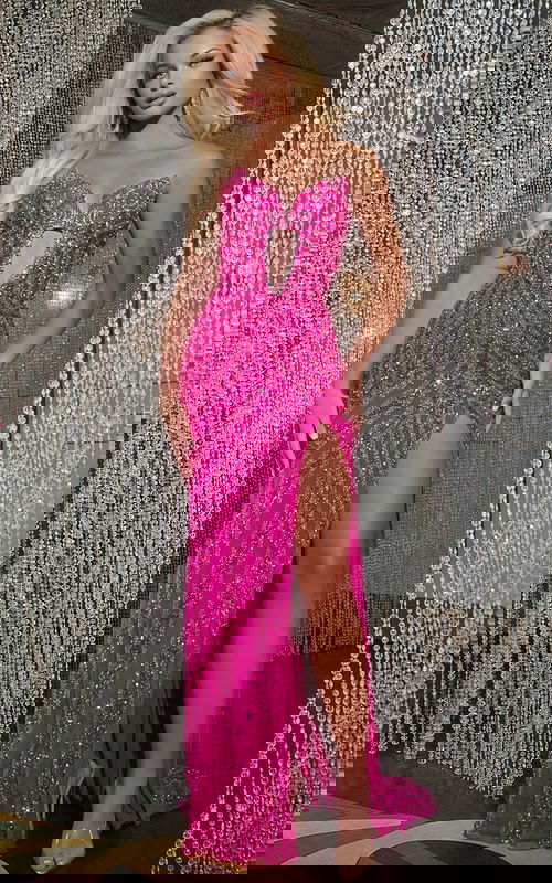 Model wearing Jovani D5724 floor-length fuchsia gown with sweetheart neckline and high slit.