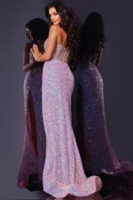 Back view of model in Jovani D5742 pink gown showing detailed beaded back.