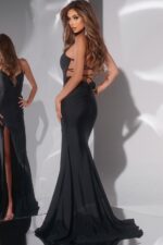 Model showing back of Jovani D5821 black dress with criss-cross straps.