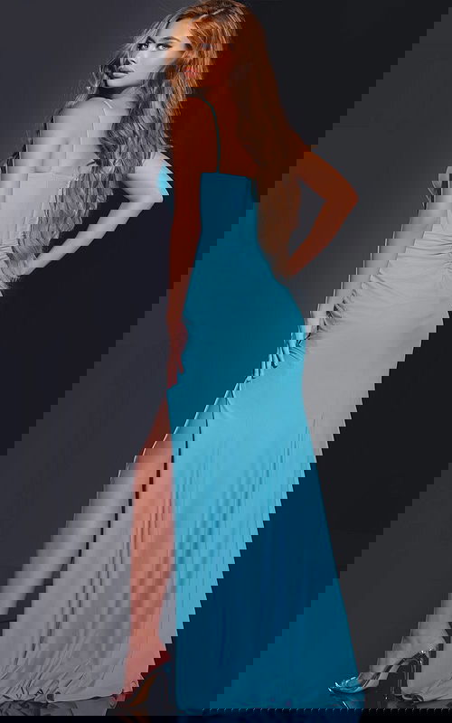 Back view of model in D5820 blue gown showcasing rear design