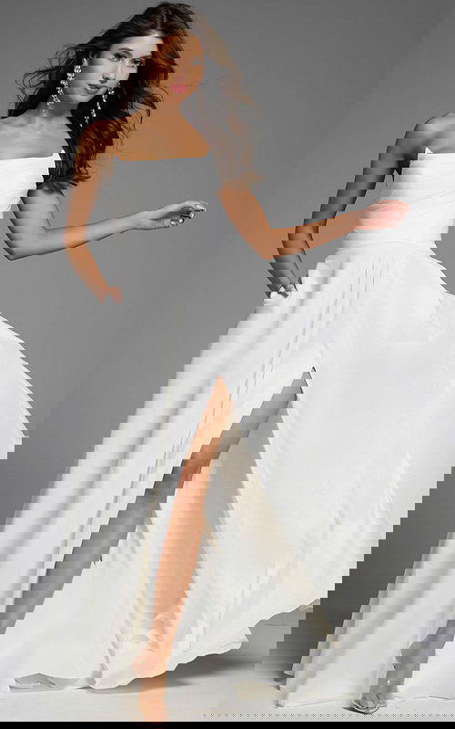 Strapless white A-line dress with slit.