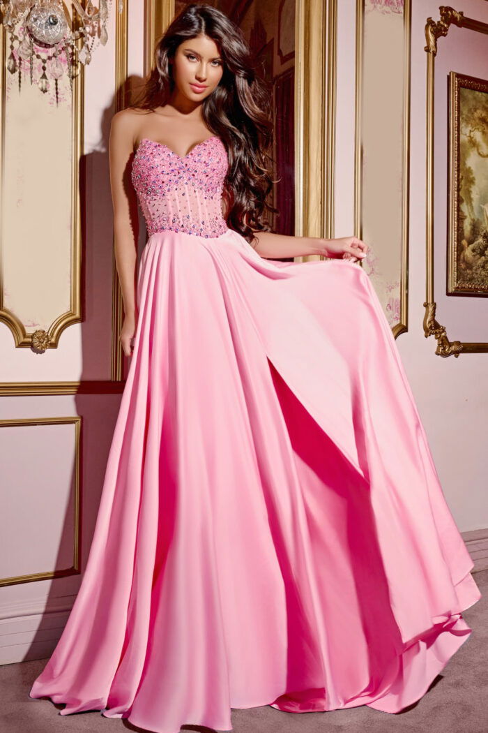 Model wearing Jovani D6021 pink gown with beaded bodice and sweetheart neckline.