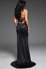 Model showing back view of Jovani D6025 black gown with open corset-style back