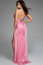 Rear view of pink gown showing lace-up back and flowing train.