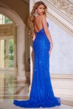 Model in Jovani D6107, showcasing the open back of the royal blue gown.