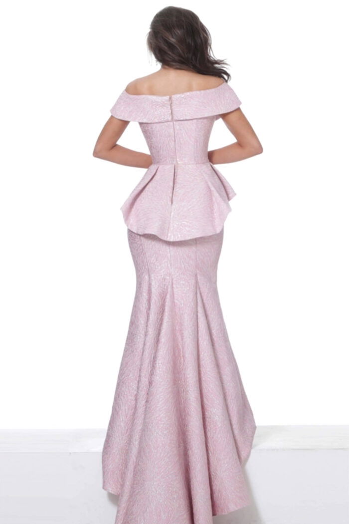 Model wearing Jovani 03944 pink gown, back view showing peplum detail
