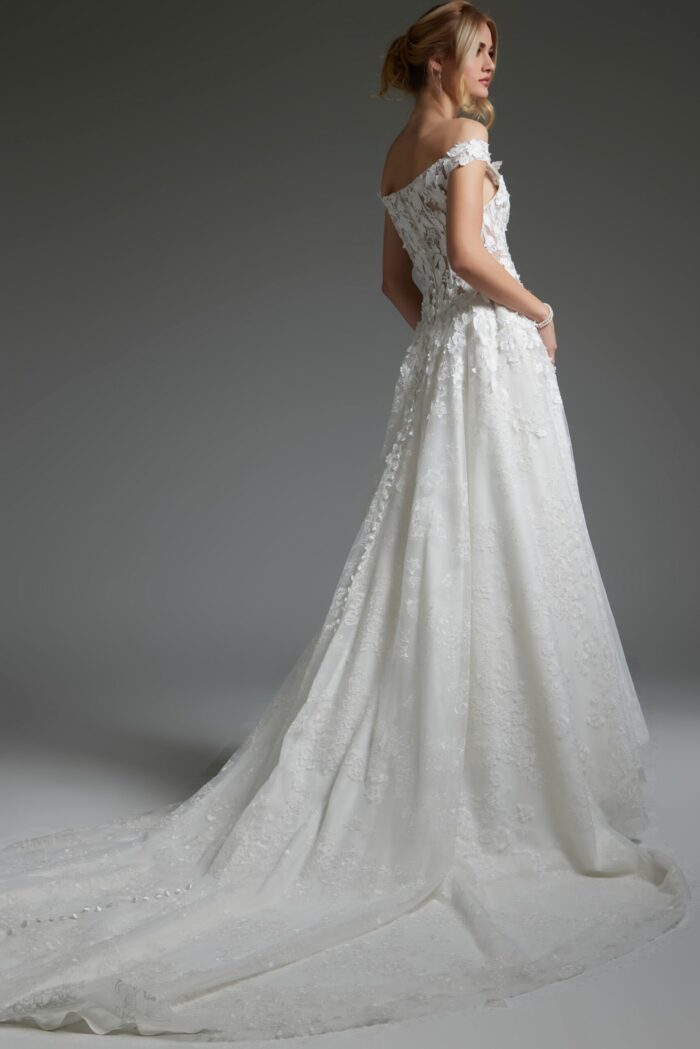 Model wearing Jovani JB05402 showing the back of an off-the-shoulder white dress.