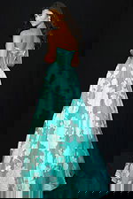 Floral embroidered strapless ball gown with flowing skirt and sheer bodice