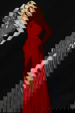 Side view of red cutout gown with cascading ruffle detail