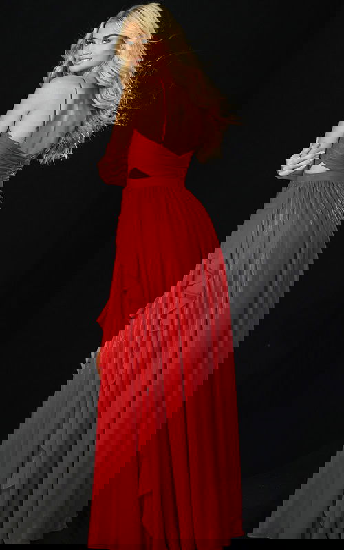 Back view of red gown with open back and layered ruffle train