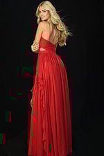 Back view of red gown with open back and layered ruffle train
