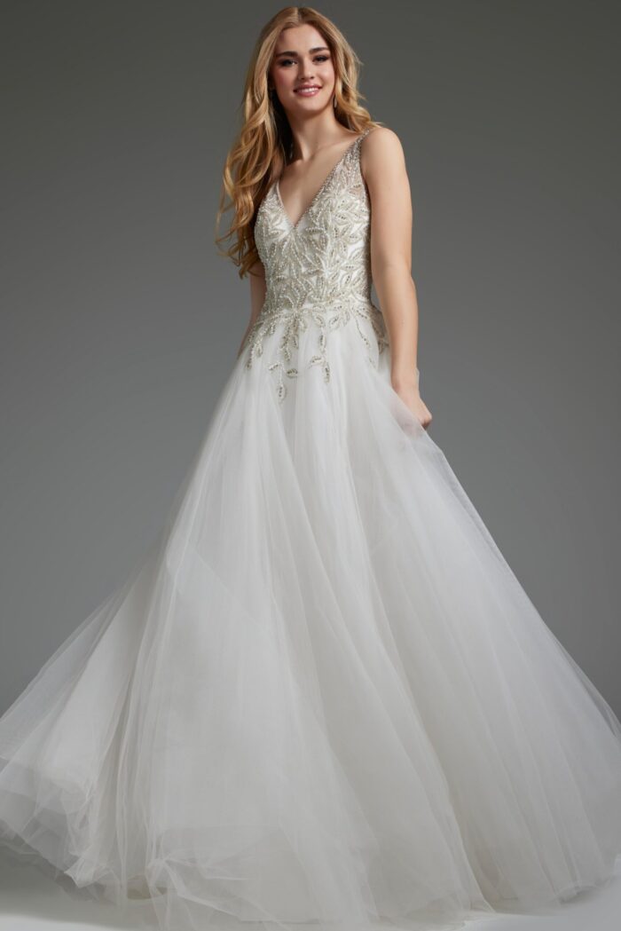 Model wearing Jovani JB03500 white gown with V-neckline and beadwork on the bodice.