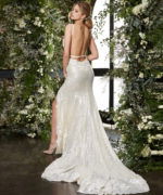 Model wearing JB03592 beige gown with an open back.