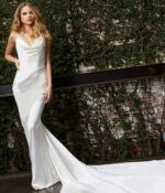 Model wearing Jovani JB03910 white dress with mermaid design and cowl neckline.