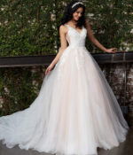 Model showcasing Jovani JB05353 white gown, front view with flowing skirt