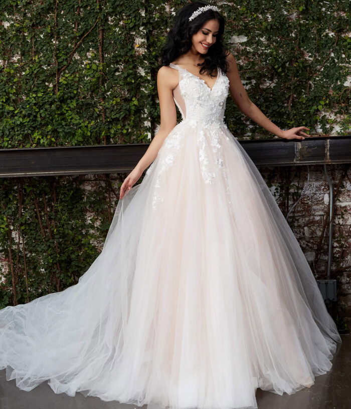 Model showcasing Jovani JB05353 white gown, front view with flowing skirt