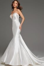 Model wearing JB05356 white mermaid dress, side view showcasing the flared skirt and strapless neckline.
