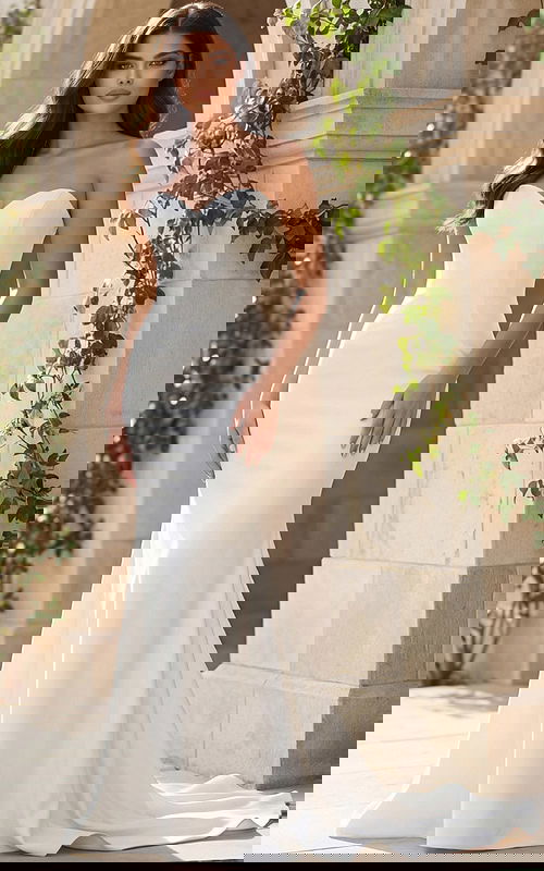 Strapless sweetheart fitted gown with smooth satin finish and small train.