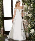 Model in Jovani JB07134 ivory dress with a romantic off-the-shoulder style and beaded details, front view.