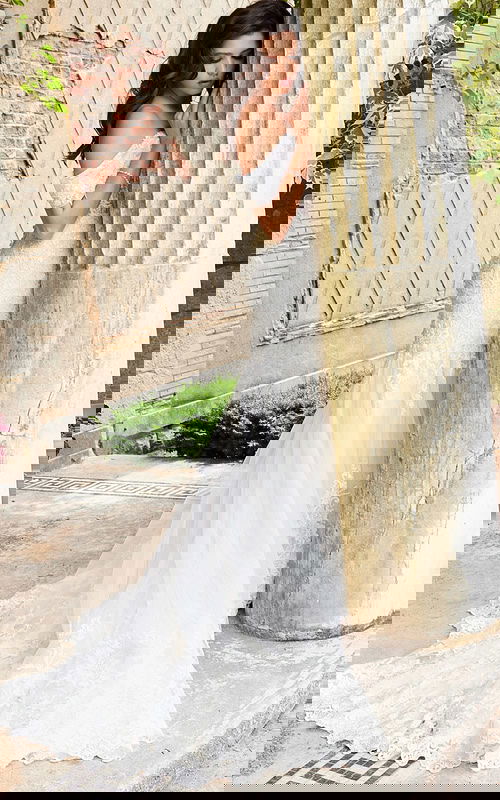 Side view of Jovani JB07161 ivory dress with flowing skirt