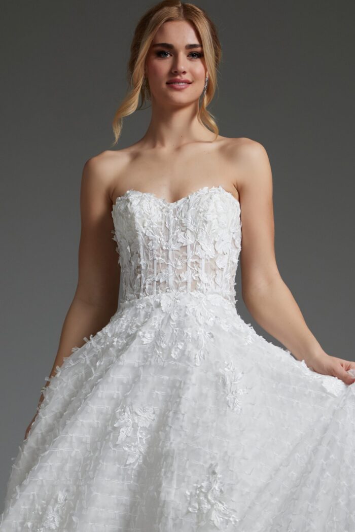 Model wearing Jovani JB07165 white gown with sweetheart neckline and floral details, close-up front view.
