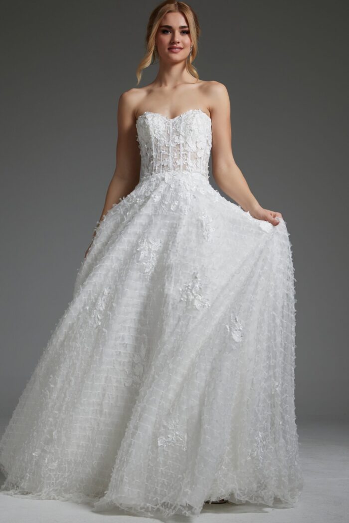 Model wearing Jovani JB07165 white gown with intricate floral patterns, front view.