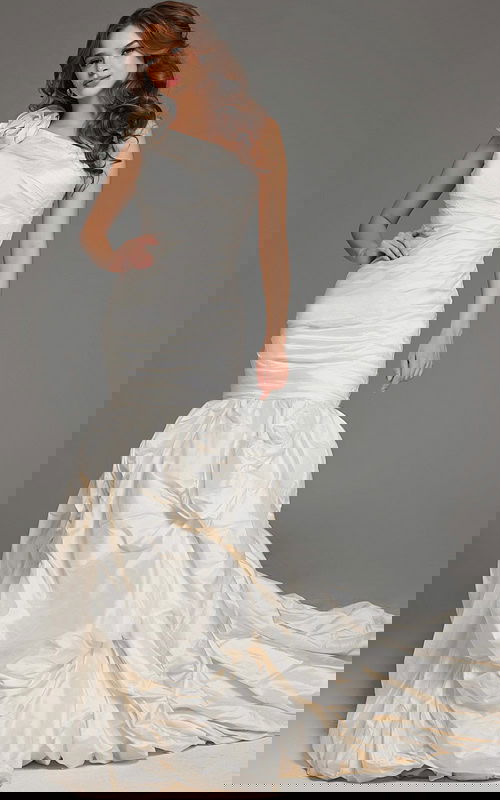 Model wearing Jovani 07179 white gown with one-shoulder neckline and mermaid silhouette, front view.