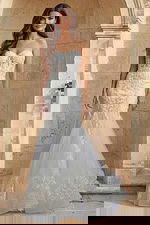 Strapless lace gown with sheer corset bodice, floral embroidery, and soft mermaid tulle skirt.