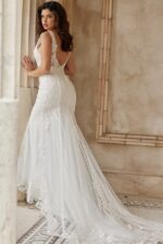 Back view of Jovani JB07385 ivory dress, highlighting low back and train.