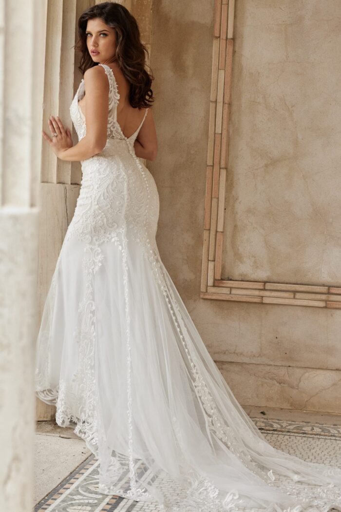 Back view of Jovani JB07385 ivory dress, highlighting low back and train.