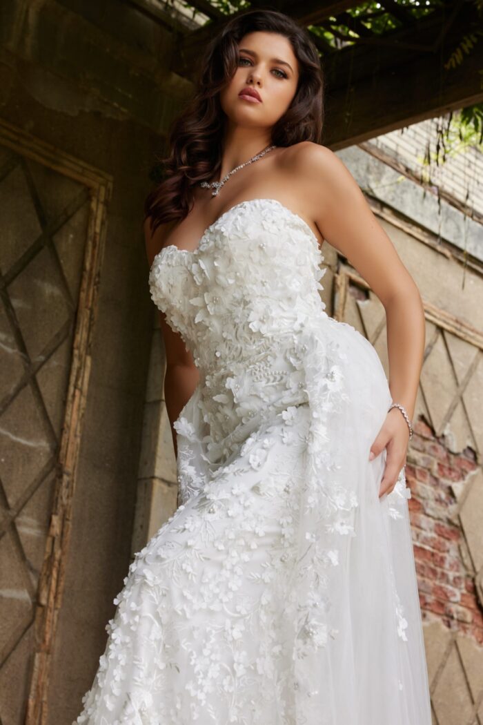 Model in Jovani JB07452 white dress featuring a strapless design, close-up view.