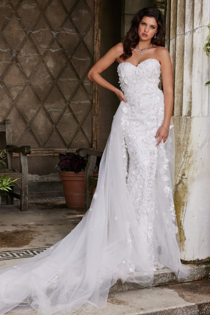 Model wearing Jovani JB07452 white gown with sweetheart neckline and floral appliqués, front view.