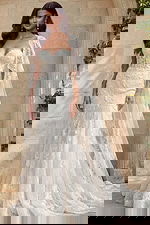 Lace mermaid gown with sweetheart bodice and detachable sheer cape sleeves with embroidered edging.