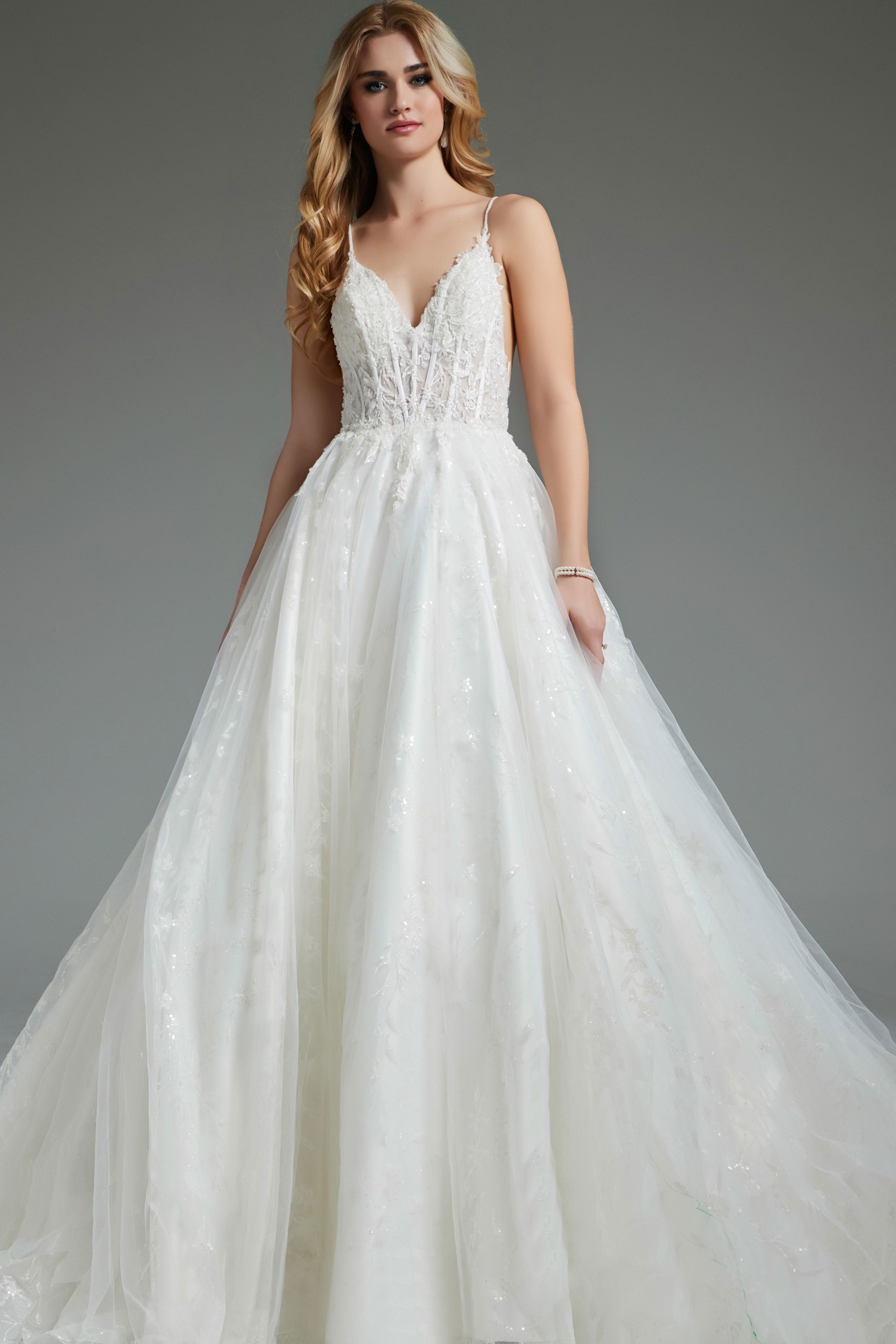 JB07647-IVORY-2010.jpg Model wearing Jovani JB07647 ivory dress with V-neckline and A-line silhouette.